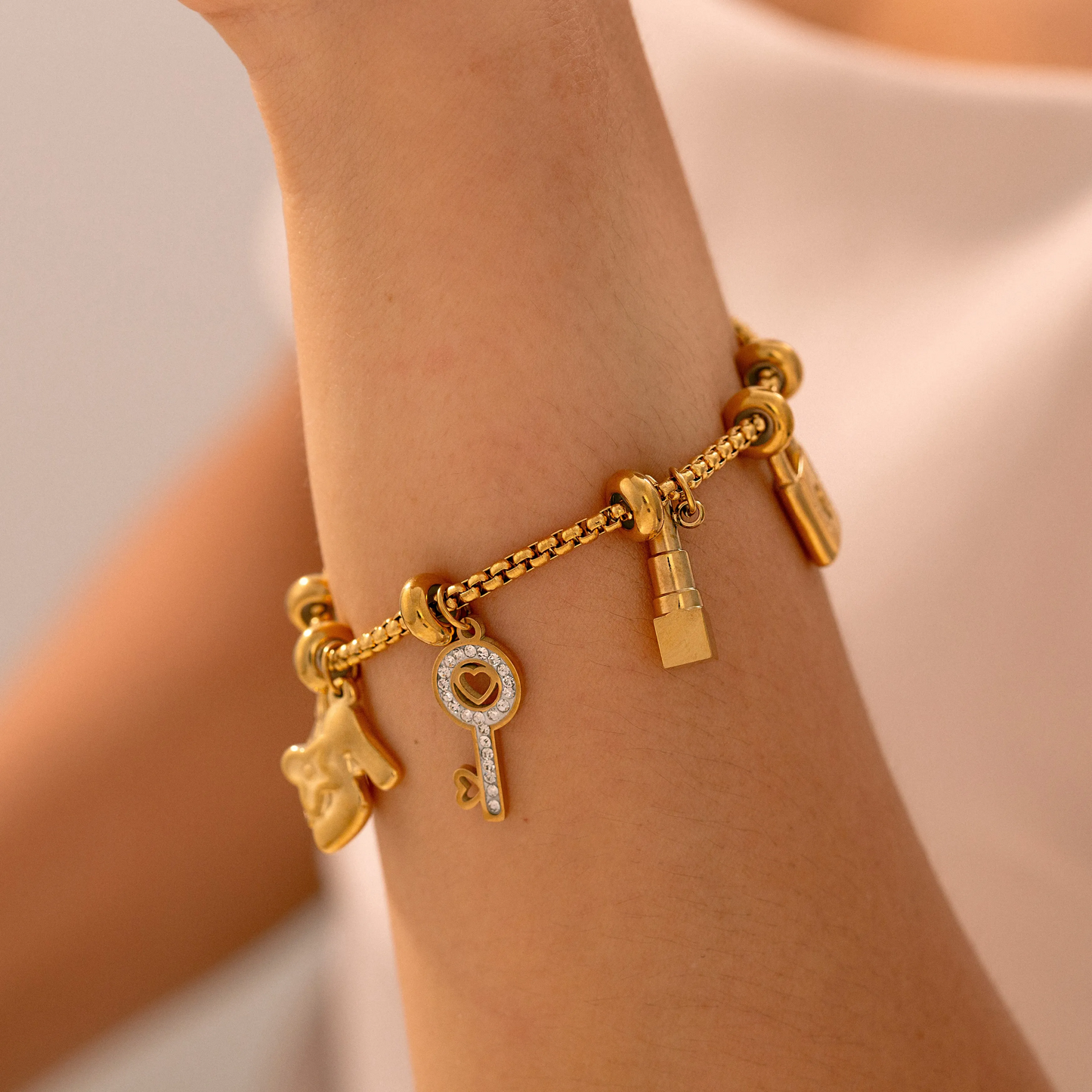 Multi-Pendant Gold Plated Charm Bracelet